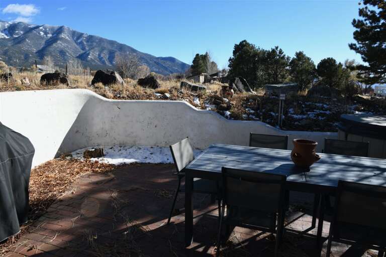 Yard enclosed by adobe wall
