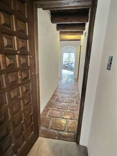 Carved wood doors and tiled floors