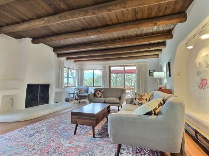 Living room with massive adobe fireplace