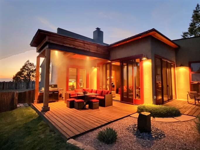 Patio and house lit up at night