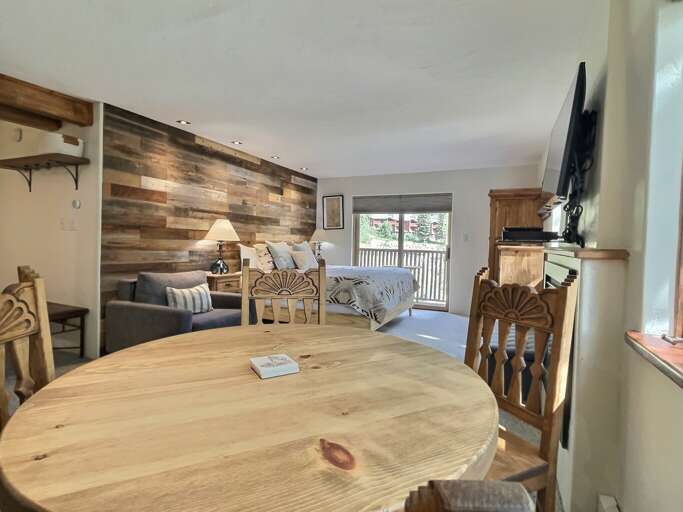 Dining table looks into the studio bedroom