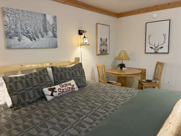 Sink into this cozy mountain retreat after a day on the slopes. The rustic pine bed and warm alpine touches create your perfect base camp for winter adventures.