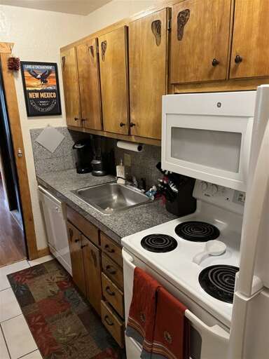 Great functional galley kitchen with everything you need to cook and serve meals