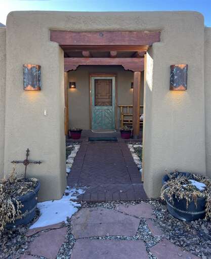 Charming entryway through abode style courtyard