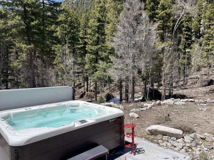 Hot tub looking into mountain forest landscapes