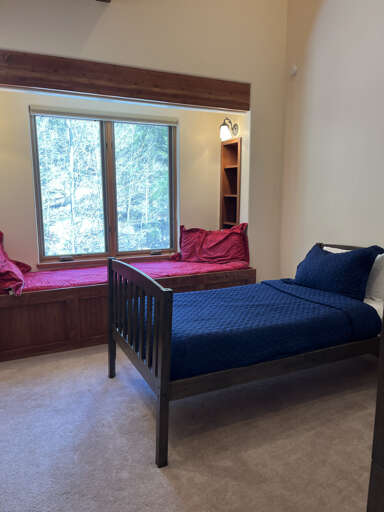 Bunk room with day bed built into the window