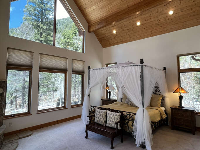 King bedroom with massive picture windows