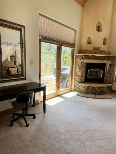 Desk and fireplace in the king bedroom