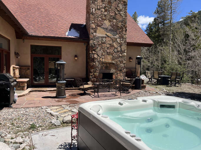 Hot tub, patio and outdoor fireplace