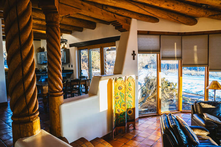 Relax in your adobe-style retreat with stunning river views, rustic vigas, and handcrafted details that create pure Southwest charm.