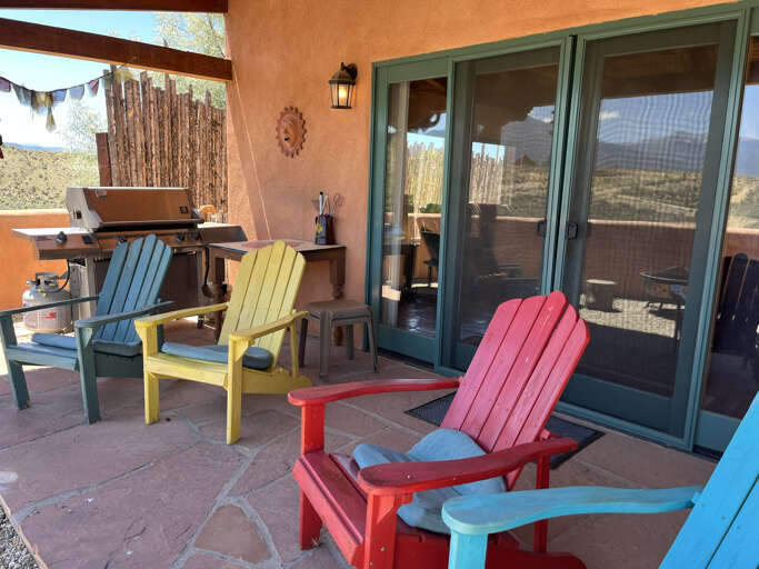 Adirondack chairs for soaking in the mountain views just outside the living area