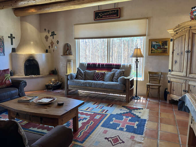 Living area with kiva fireplace