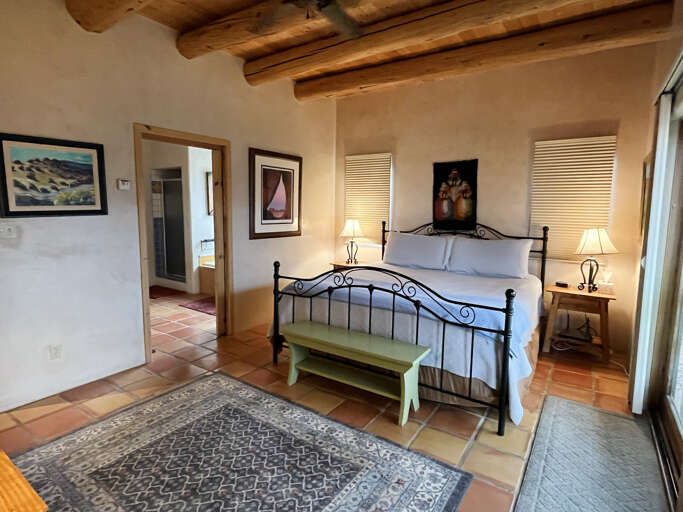 Primary bedroom with ensuite bath and hot tub access