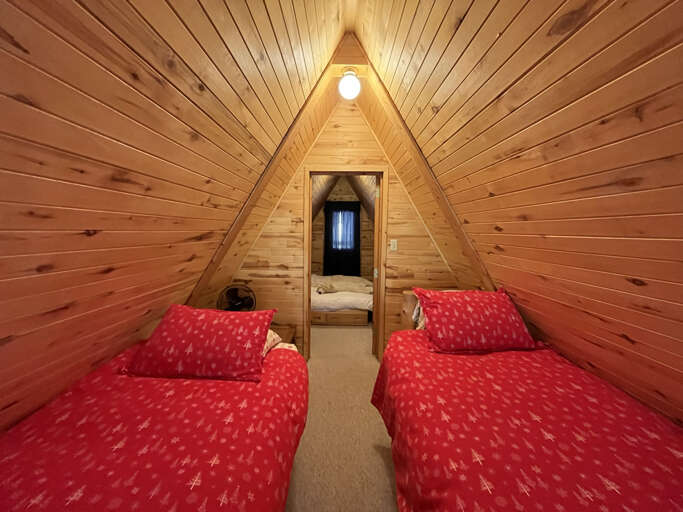 Upstairs A Frame loft twin beds