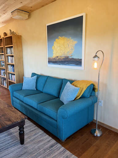 Comfy couch with cozy-making blanket and pillows