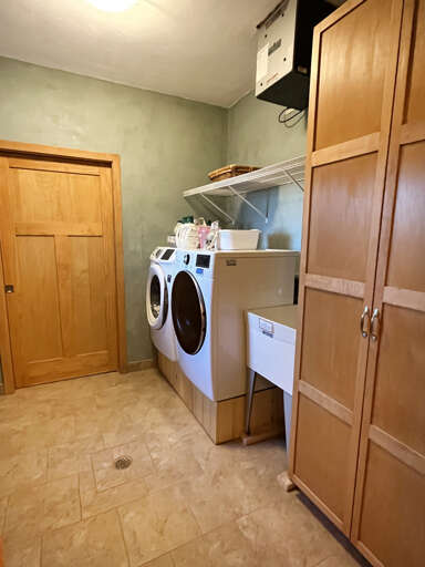 Washing room with great storage and laundry facilities off the primary bathroom