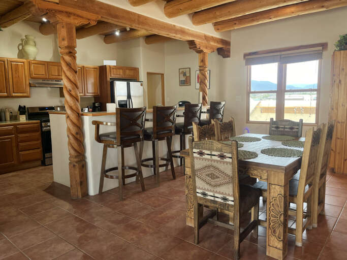 Kitchen and dining area with bar seating