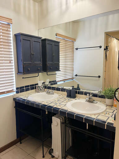 Bathroom with shower and double vanity