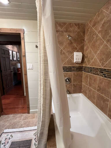 Upstairs queen bathroom tub shower combo