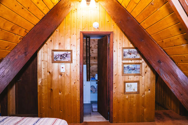 Loft twin and door to upstairs bathroom