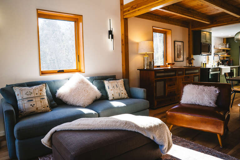 Cozy livingroom in an open concept second level with deck