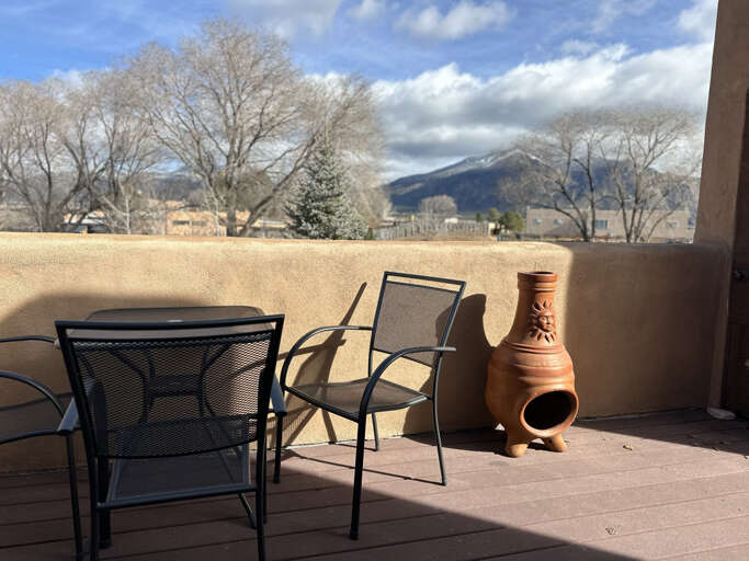 Relax on your private terrace with stunning mountain views and a charming chiminea for cozy evenings under the southwestern sky.