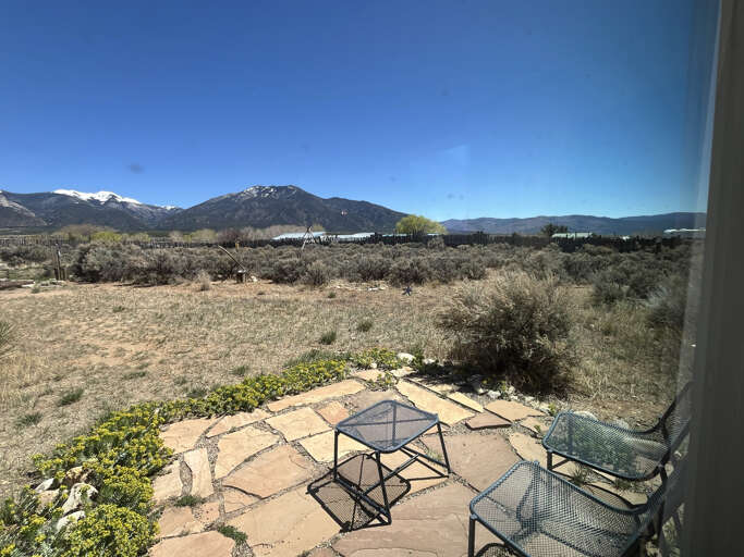 Stunning mountain views stretch endlessly from your private patio, where desert landscapes meet snow-capped peaks under brilliant blue skies.