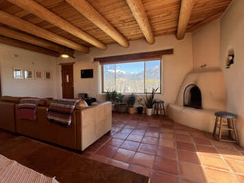 Unwind by your private adobe fireplace while mountain views stretch endlessly beyond the picture window.