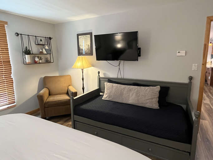 Day bed with trundle twin offers more sleeping space for families in the primary suite.