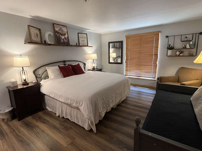 Unwind in your cozy bedroom with crisp linens, warm lighting, and thoughtful touches. Settle into the plush bed after a day of adventure.