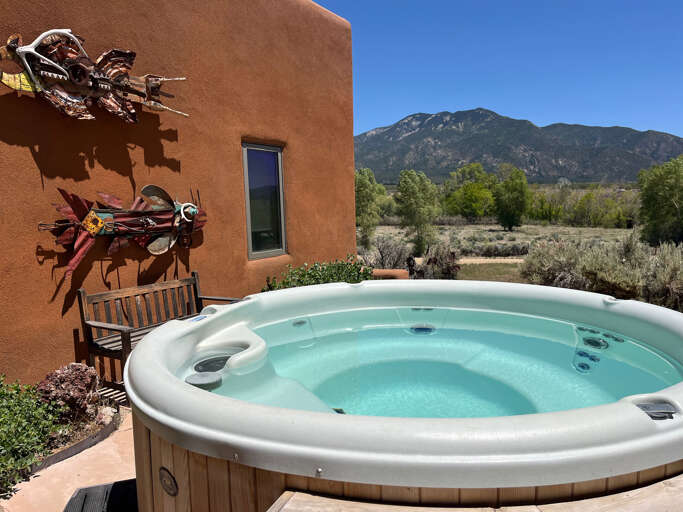 Soak in your private hot tub and take in the peaceful high-desert landscape.