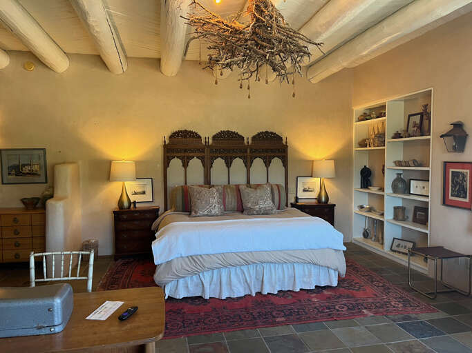 Spacious King suite bedroom with all kinds of charming details.