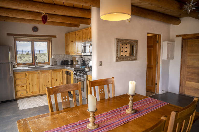 Cook meals with great views through the window, then gather around the handcrafted table for connection and relaxation.