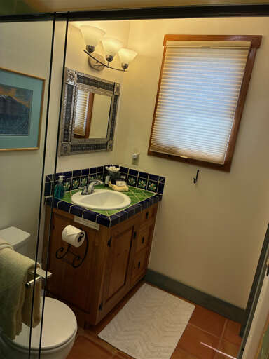 Colorful Talavera tile accents this bright bathroom