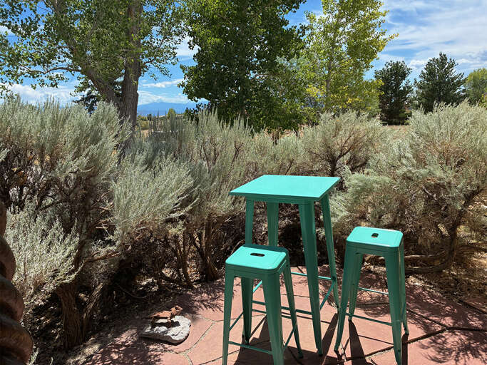 Perfect cafe table on the east side of the house is perfect for shady evening meals or drinks, or sunny morning coffee!
