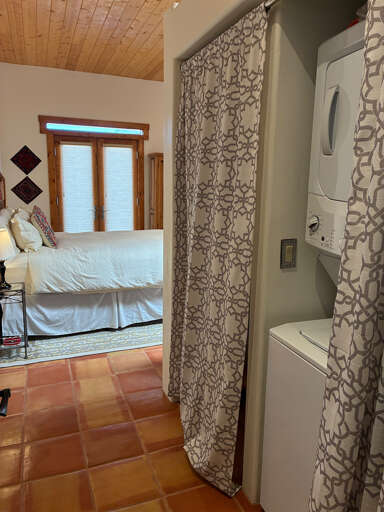 A full size washer and dryer are tucked nicely into the back hall between bed and bathroom