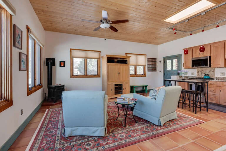 Gather around the cozy seating area or fix a quick meal at the breakfast barâyour open-concept living space invites you to relax under natural light streaming through skylights and windows.