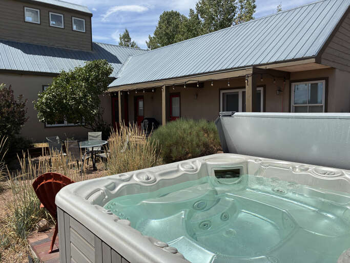 Slip into your private hot tub and let the warm bubbles melt away the day while you take in the peaceful garden surroundings and mountain air.