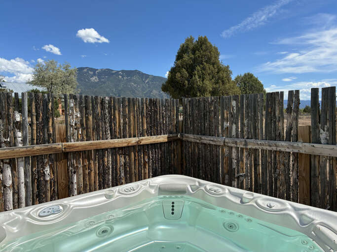 Soak away your cares with mountain views and wide-open skies just beyond your private fenced patio—your perfect retreat after a day of exploring.