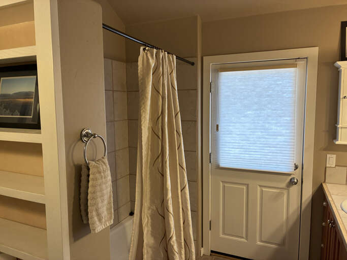 Step into your private oasis with a spacious walk-in shower, fresh towels at hand, and natural light filtering throughâyour perfect retreat after a day of adventure.