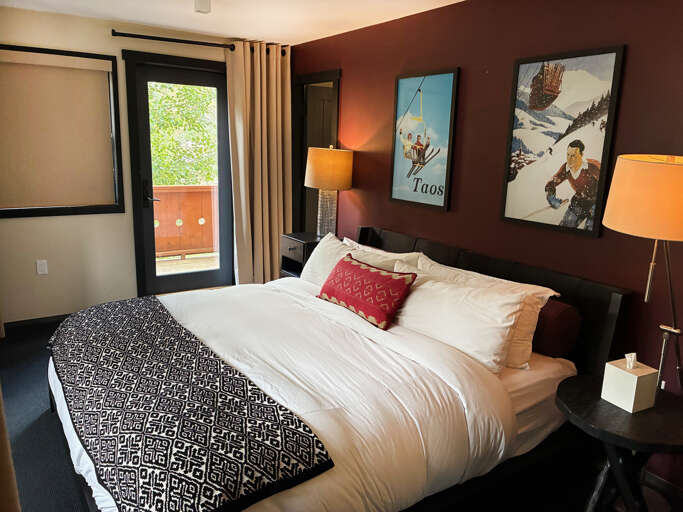Sink into soft linens and enjoy warm bedside lighting as you unwind in your private retreat. Step out to your balcony for fresh air and peaceful moments.