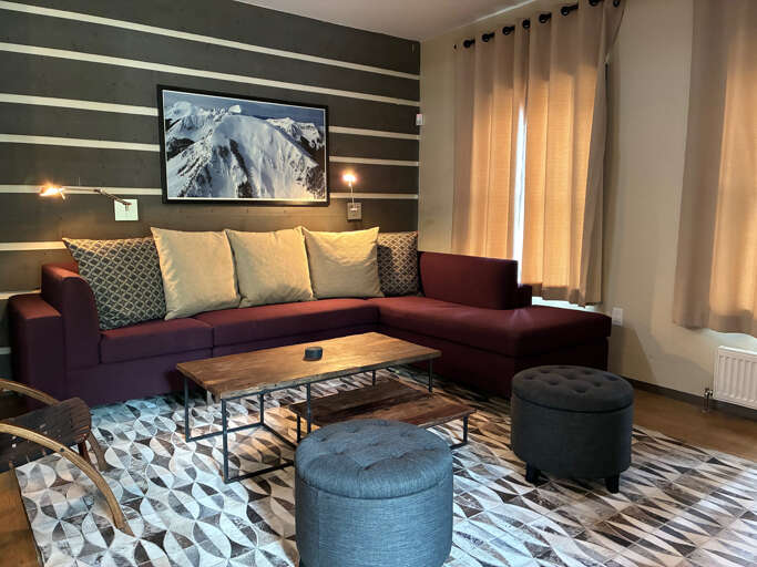 Sink into plush seating and unwind in your stylish living space, thoughtfully designed with warm textures and modern accents to make you feel completely at home.