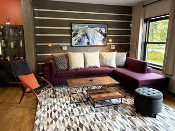 Sink into your plush sectional and let natural light fill this beautifully designed space, complete with thoughtful details and a cozy accent chair where you can unwind with your favorite drink.