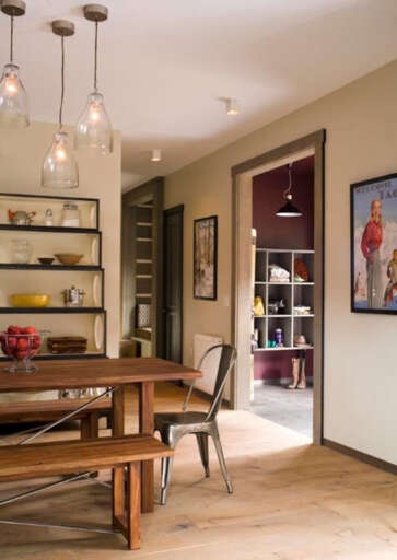 Gather around this warm, inviting dining space where rustic charm meets modern comfort. The handcrafted wood table and cozy seating create the perfect spot for your morning coffee or evening meals.