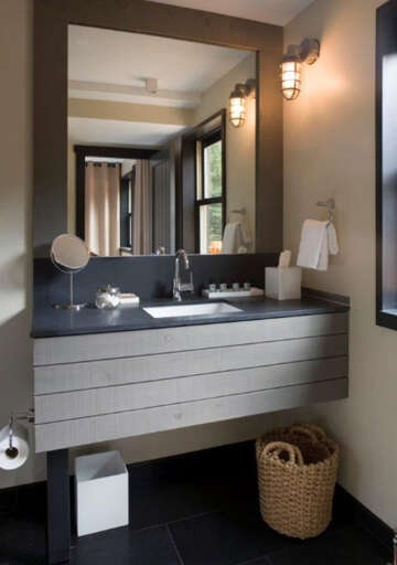 Your modern bathroom features a sleek floating vanity, nautical-inspired sconces, and thoughtful amenitiesâeverything you need to feel refreshed and at home.