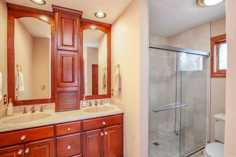 King Master Bathroom with Dual Vanities and a Walk-In Tile Shower King Master Bathroom with Dual Vanities and a Walk-In Tile Shower