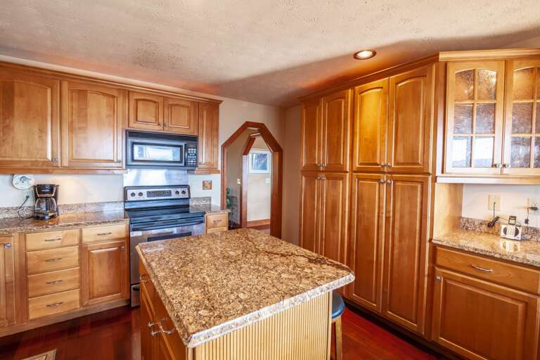 Spacious Kitchen with Granite Counters and Updated Appliances Spacious Kitchen with Granite Counters and Updated Appliances