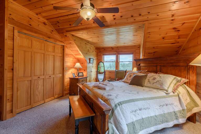 Upstairs Bedroom with Cozy Wood Finish Upstairs Bedroom with Cozy Wood Finish