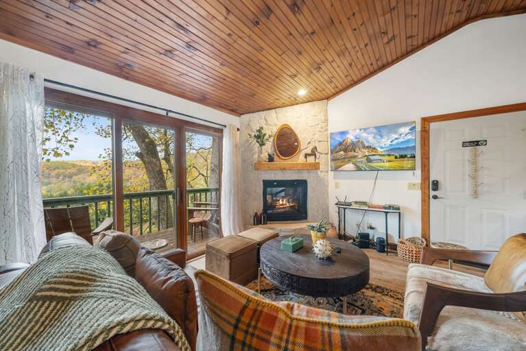 Living Area with Deck Access and Gas Fireplace and Mountain View