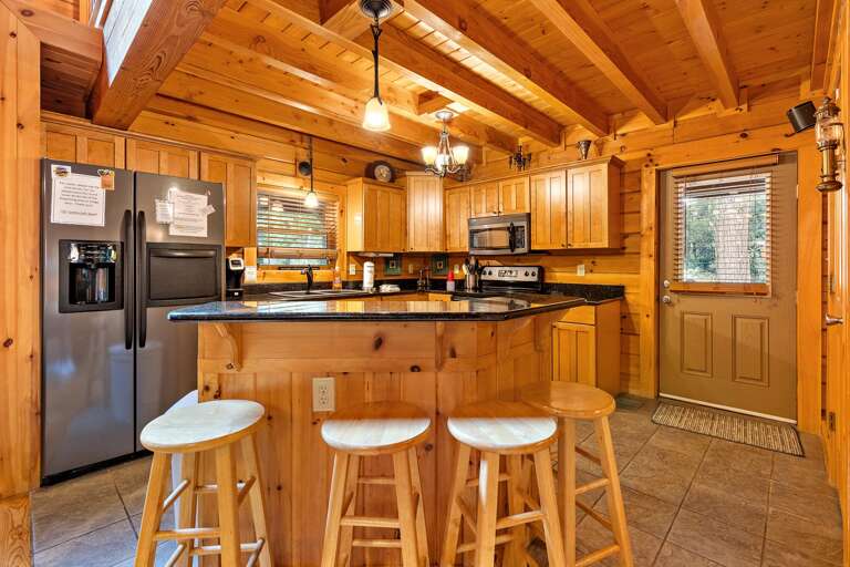 Kitchen with Granite Counters and Bar Seating Kitchen with Granite Counters and Bar Seating